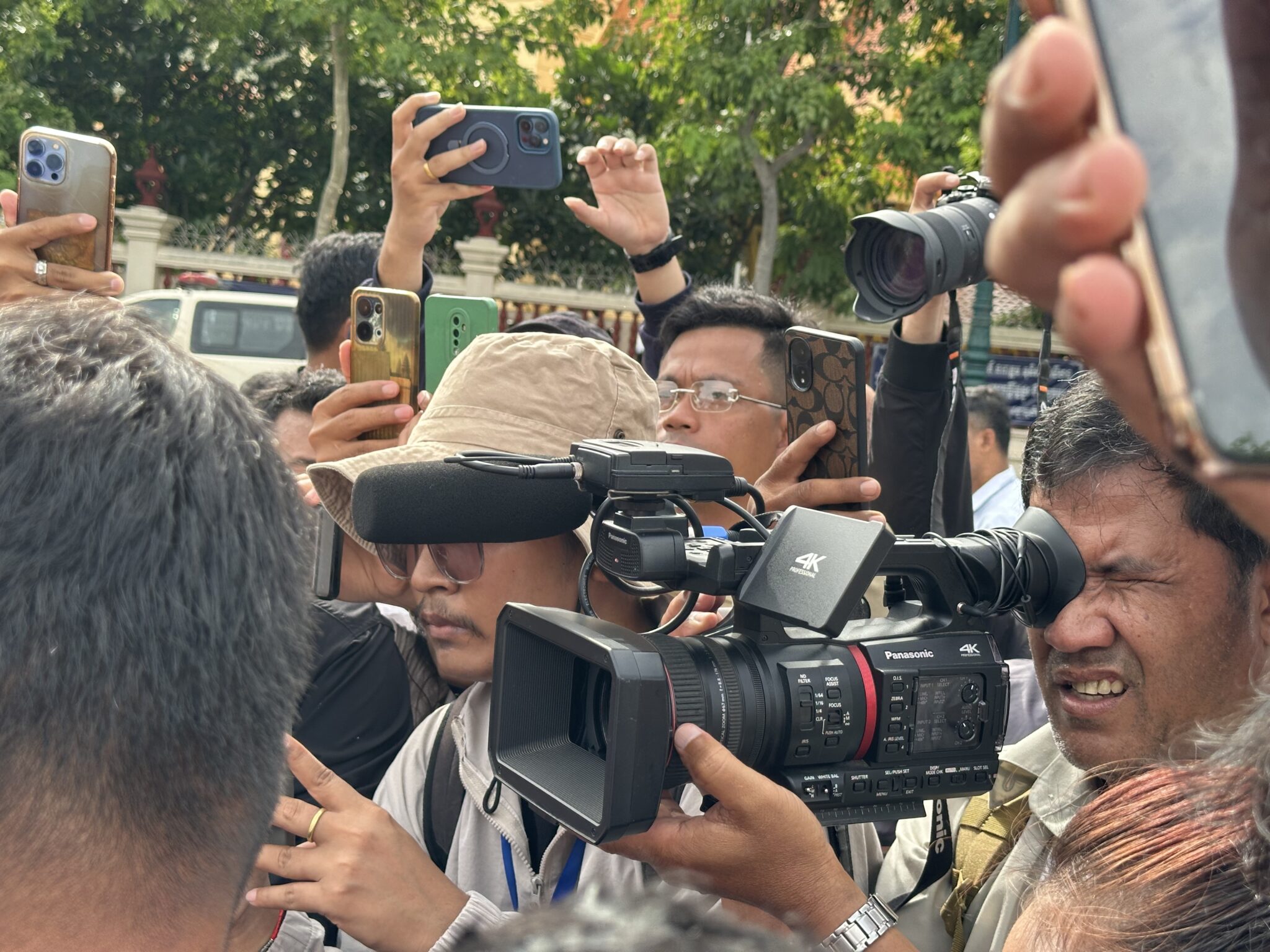 Journalists cover a protest outside the Supreme Court on 19 June 2026 as the verdict in Rong Chhun’s case is announced. (Photo: Sorn Sarath)